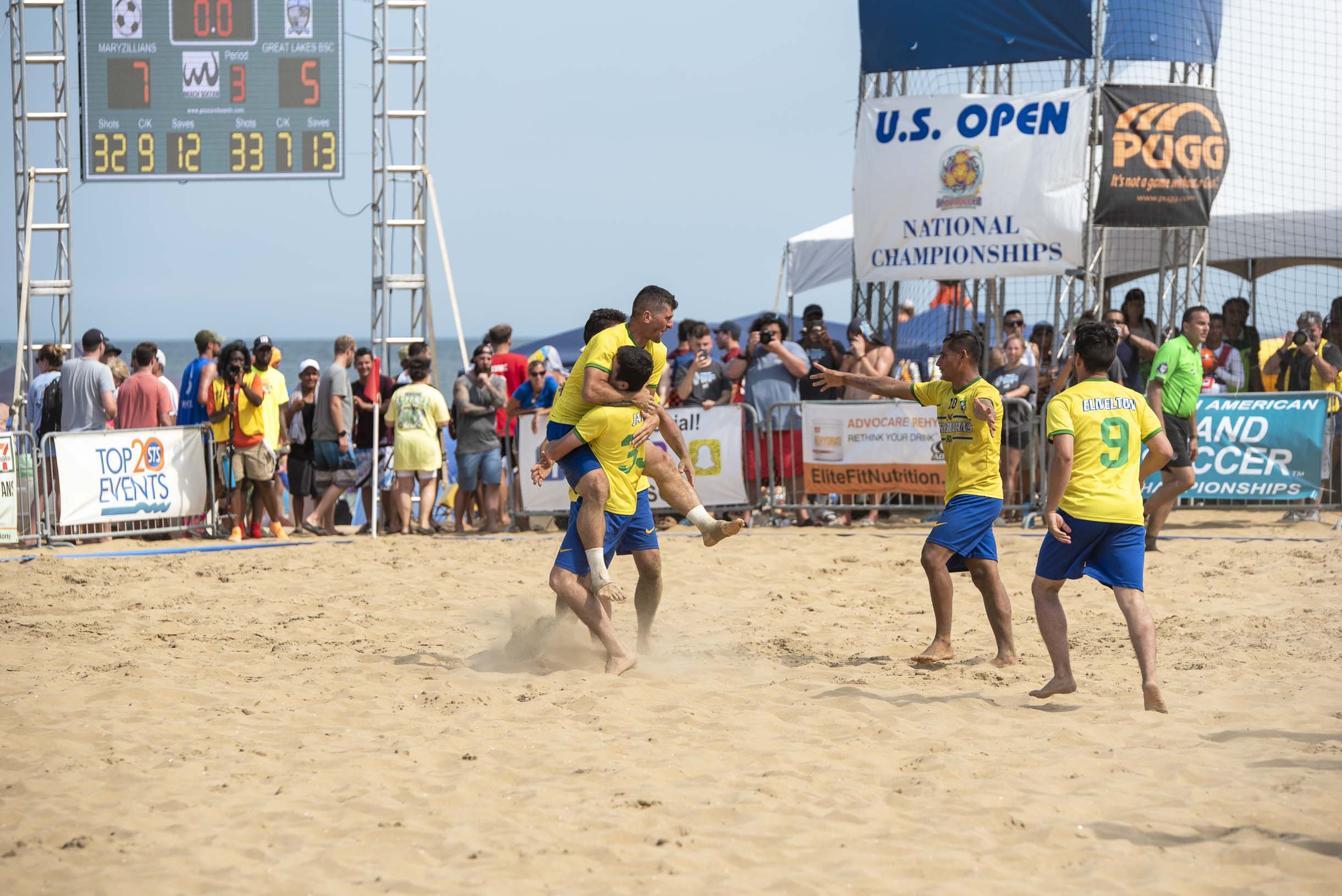 Maryzillians beach sand soccer club celebrate their 7 to 5 win over Great Lakes Beach Soccer club.